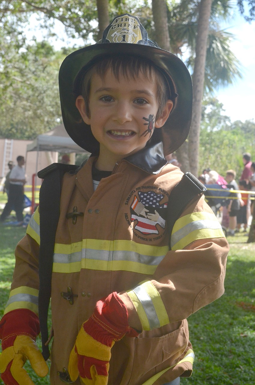 Matteo Storino, 5, participates in the Junior Fireman Combat Challenge.