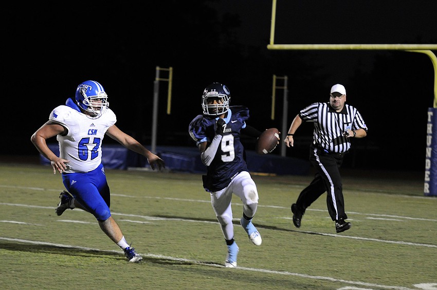 ODA quarterback David Grain scrambles for a first down in the second quarter.