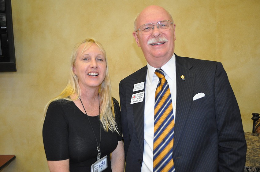 Karen Potter of CKS Energy Solutions and Jim Zientara of Raymond James and the Florida Railroad Museum