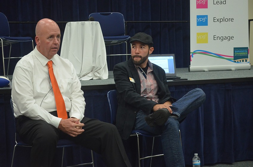 Mayor Shannon Snyder talks about his Sarasota heritage as YPG Government Issues Chair Arturo Santos Jr listens.