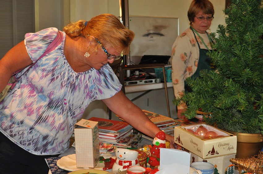 Diane Kodet checks out Christmas ornaments