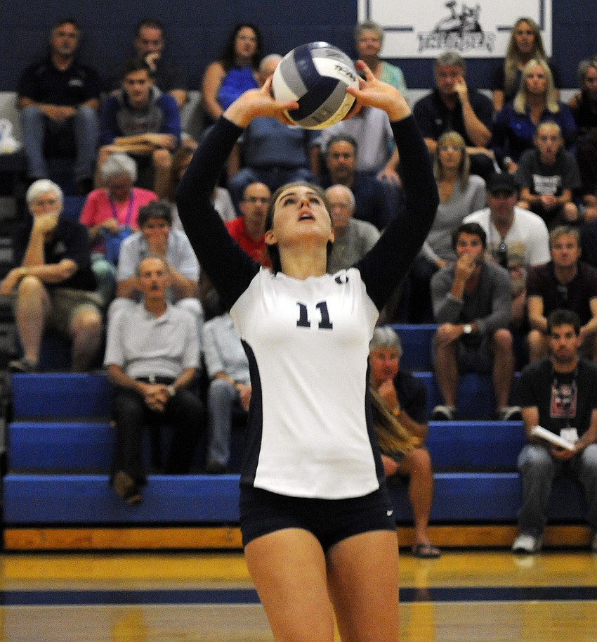 Monica Costa sets the ball up for a teammate in the first set.