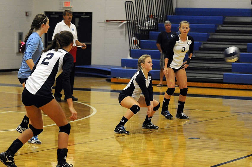 ODA freshman Greta Holland passes the ball back up to a teammate in the second set.