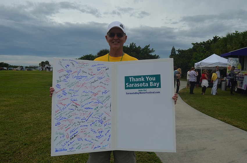 Director of the festival, Randy Moore, with a jumbo thank you card