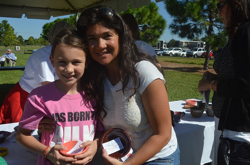 Suzanne and daughter Sally Koscho picked out their ceramic bowls