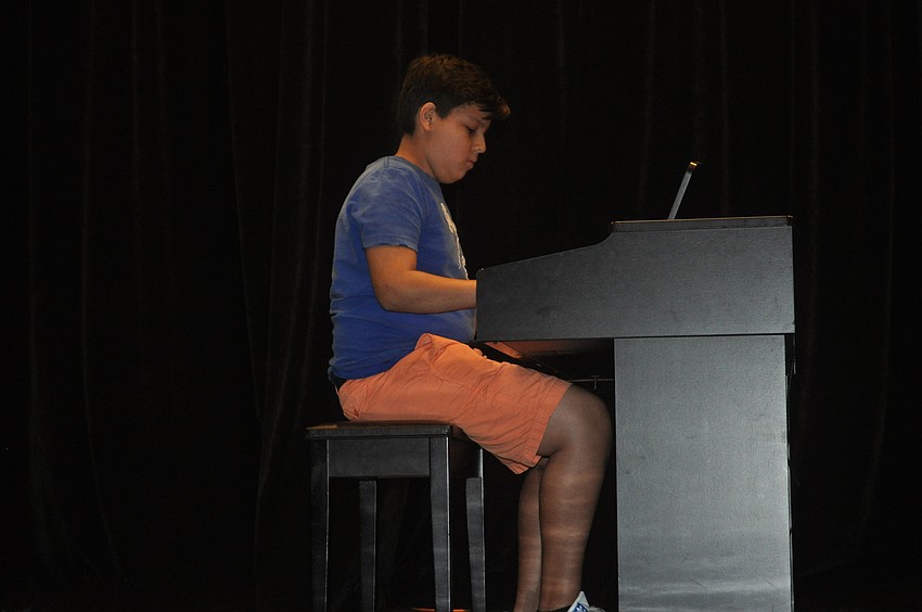 Daniel Aguirre, a seventh grader, played the piano.
