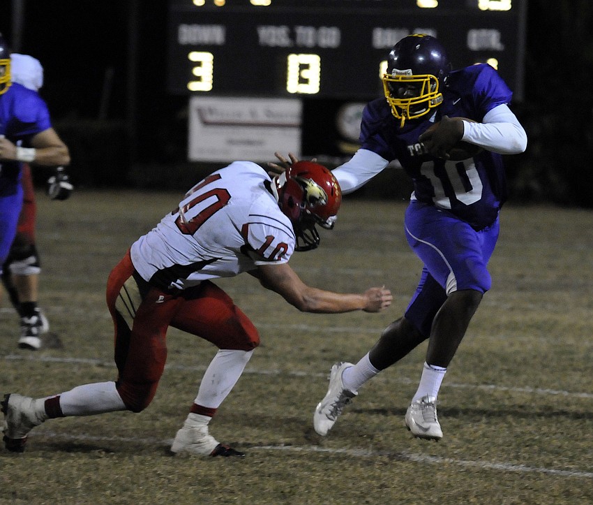 Booker quarterback Jeremiah Henderson scrambles for yardage in the fourth quarter.