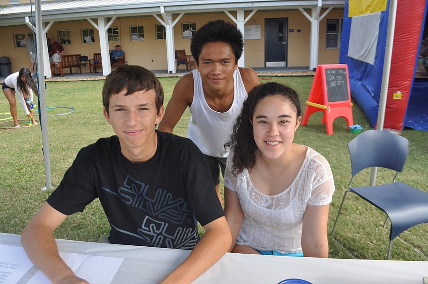 Richard Vlcek, Nam Hoang and Madeline Naylor tended to the speed pitch game.