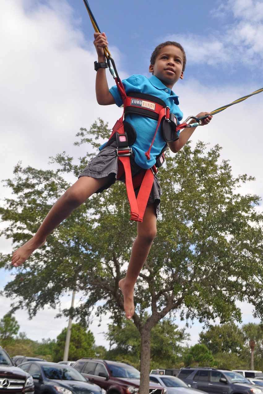 Tyler Ellerson, 6, bounced as high as he could.