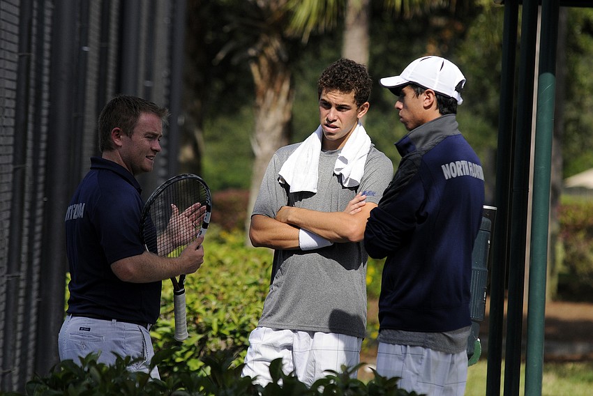 The University of North Florida menâ€™s doubles team of Zachary Goldberg, center, and Pablo Tellez, right, talk with coach Mark Finnegan, left, following their match Nov. 8.