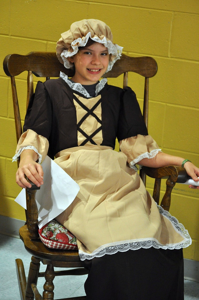 10-year-old Meghan McConnaghy dresses up as a colonial girl.