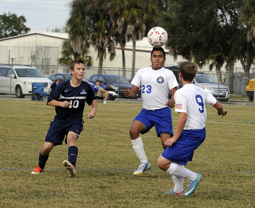 ODAâ€™s Tyler Wenger and SMAâ€™s Jose Munoz and Connor Moriarty battle for the ball in the first half.