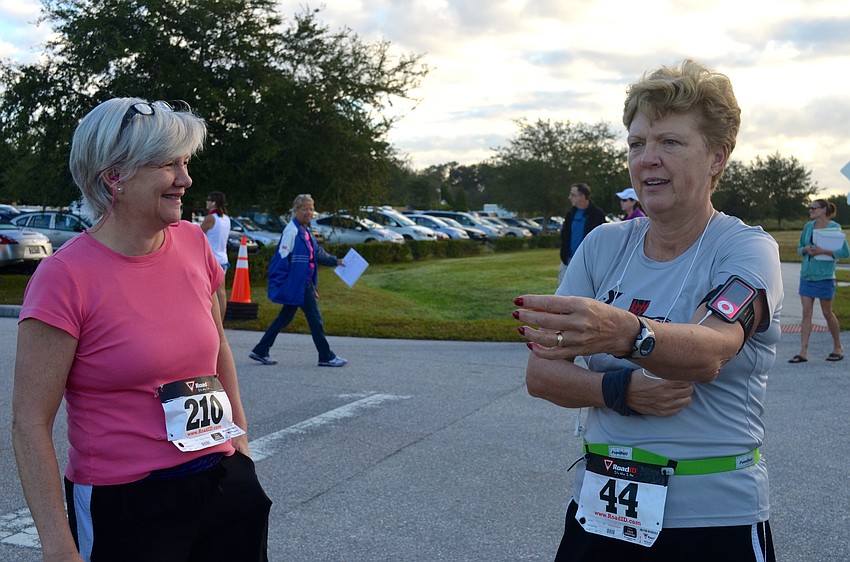 Sisters Amy Conner and Terry Cox share laughs before they run.