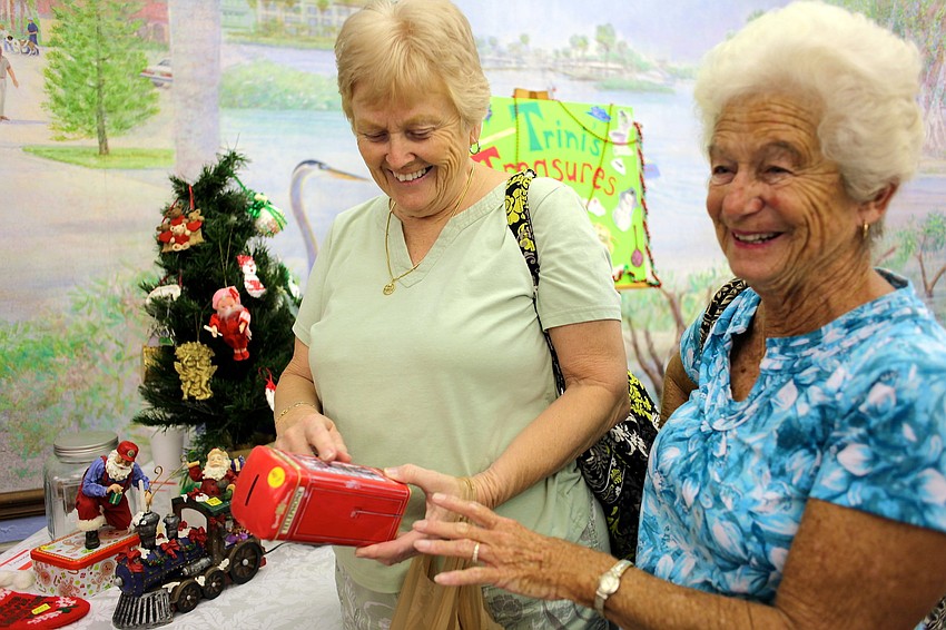Phyllis Lewis and Joan Gagnon shop the holiday bargains at the Christmas Bazaar.