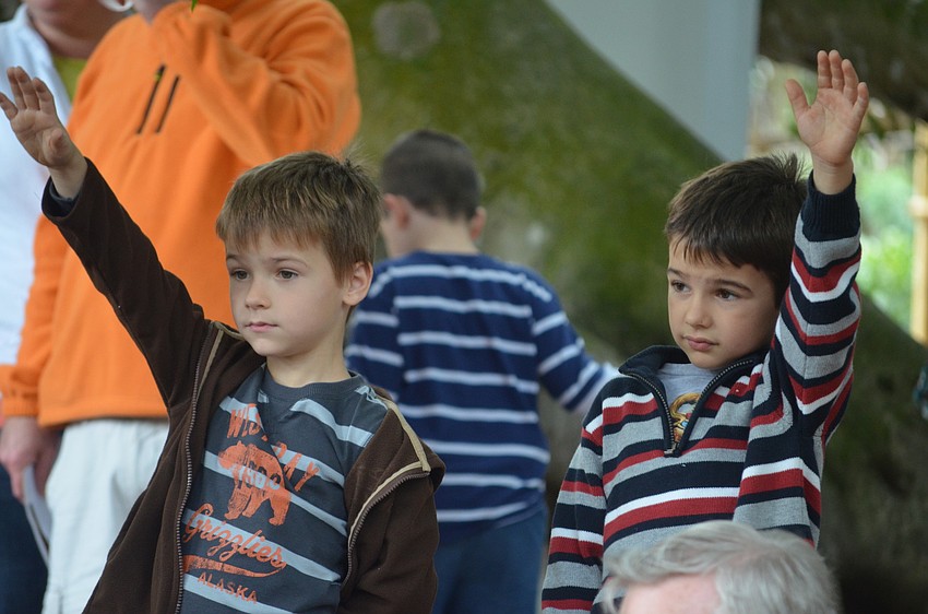 Jackson and Wesley Jr. Dicus raise their hands to ask a question