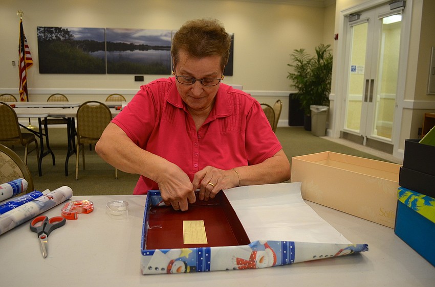 Vita Vitale focuses on wrapping the perfect shoe box.