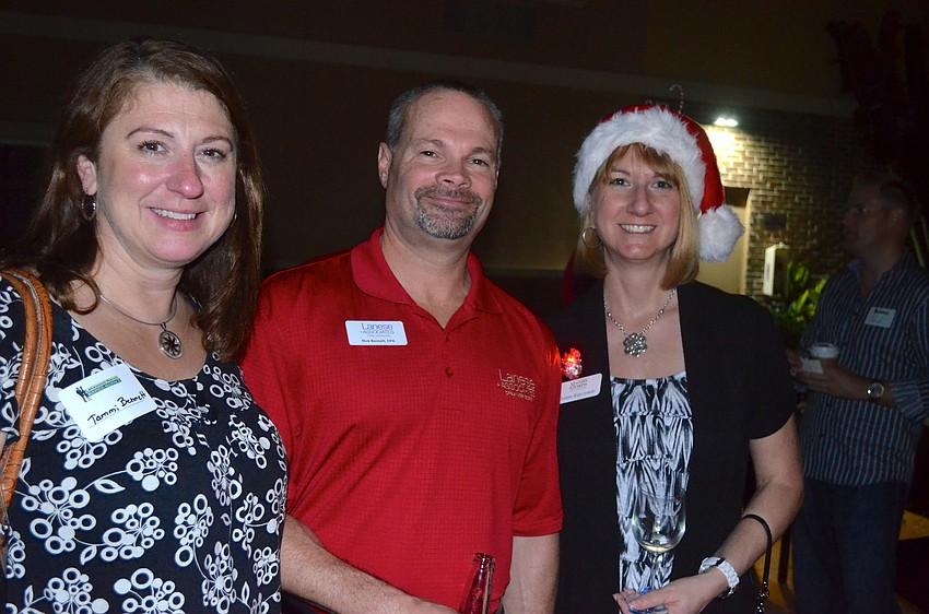 Tammi and Rick Bennett strike a pose with Dianne Kopczynski before the festivities start.