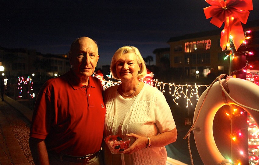 Bob and Mary Harb pose in front of their dock.