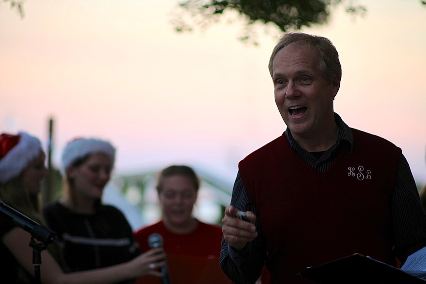 Kirby Sanders instructs the students as they sing traditional Christmas songs.