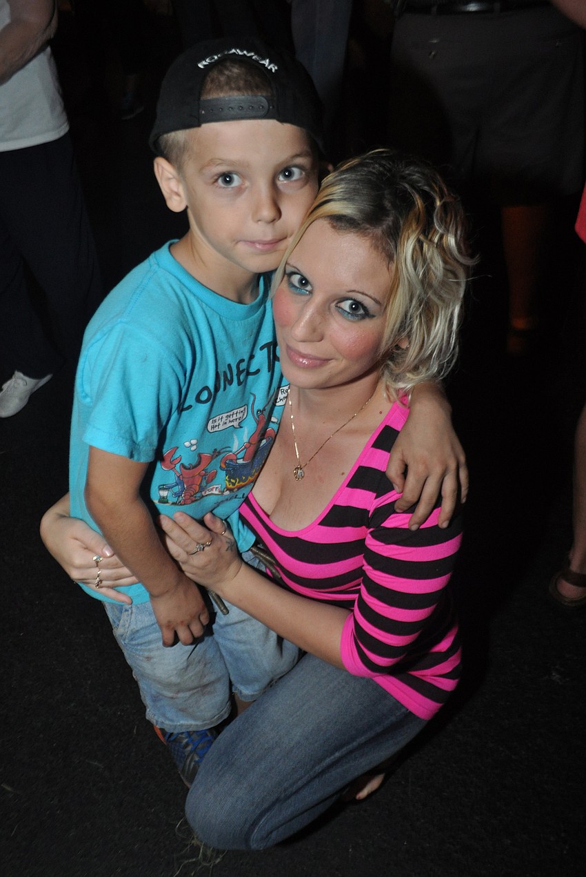 Jayden Jennings, 7, with his mom, Marie Sankowski, visits craft booths.