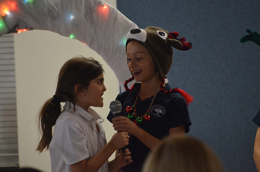 Natalie C. and Maria S. sing together.
