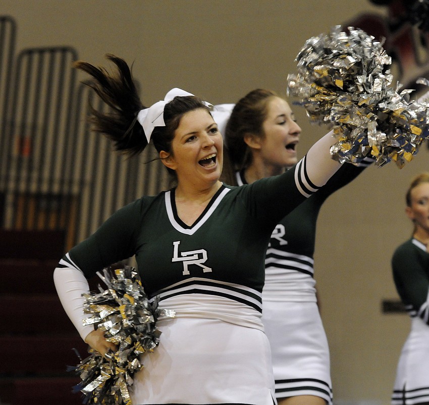 Lakewood Ranch cheerleader Bailee French pumps up the crowd at the beginning of the Mustangs routine.