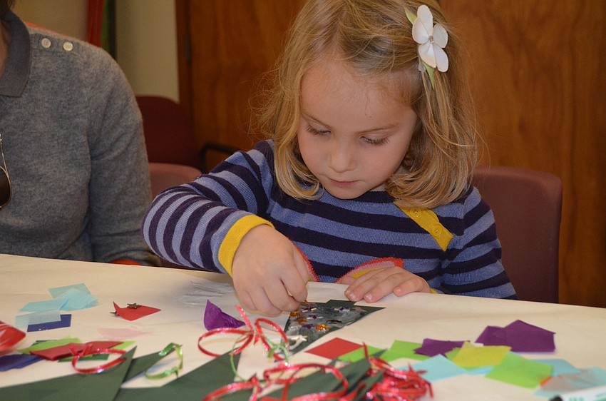 Kathryn Day works on her ornament