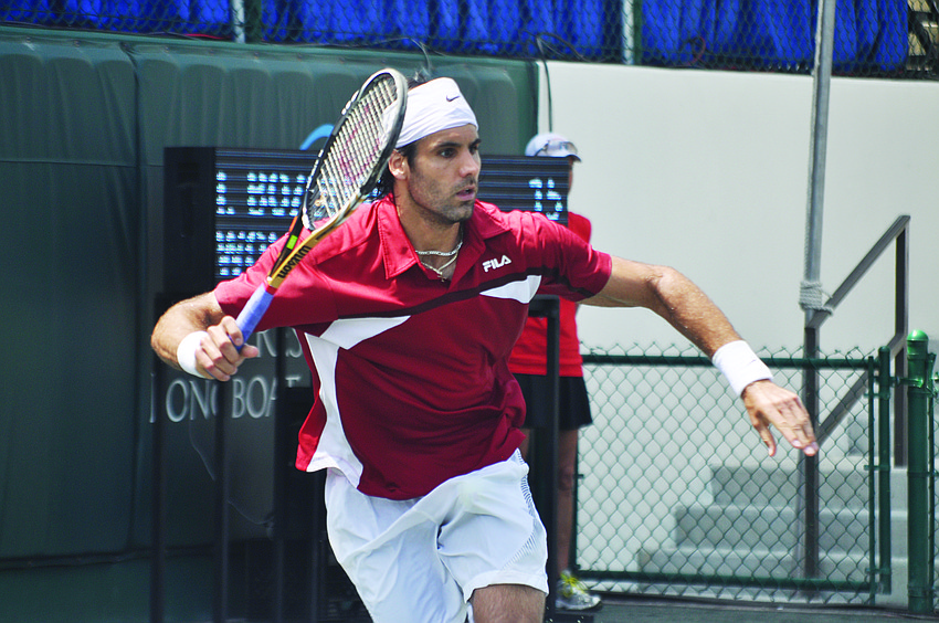 Fritz Wolmarans races to make a cross-court forehand against Ilija Bozoljac April 15, at the Sarasota Open qualifying round.