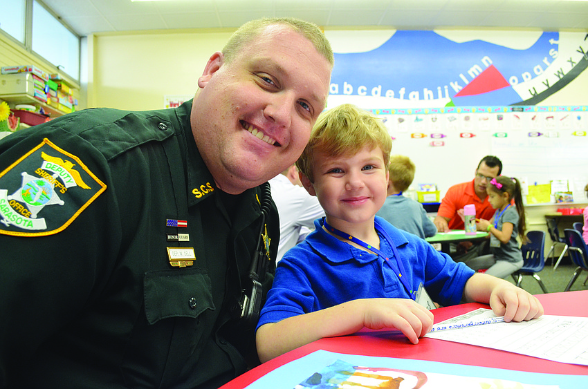Bill Sell visits his son, Liam, Sept. 17 at Fruitville Elementary, during Take Your Dad to School Day.