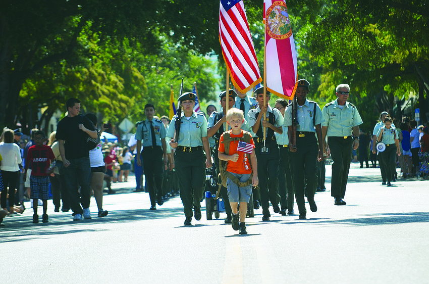 Hundreds of people line Main Street May 27 in downtown Sarasota to watch the Memorial Day Parade.
