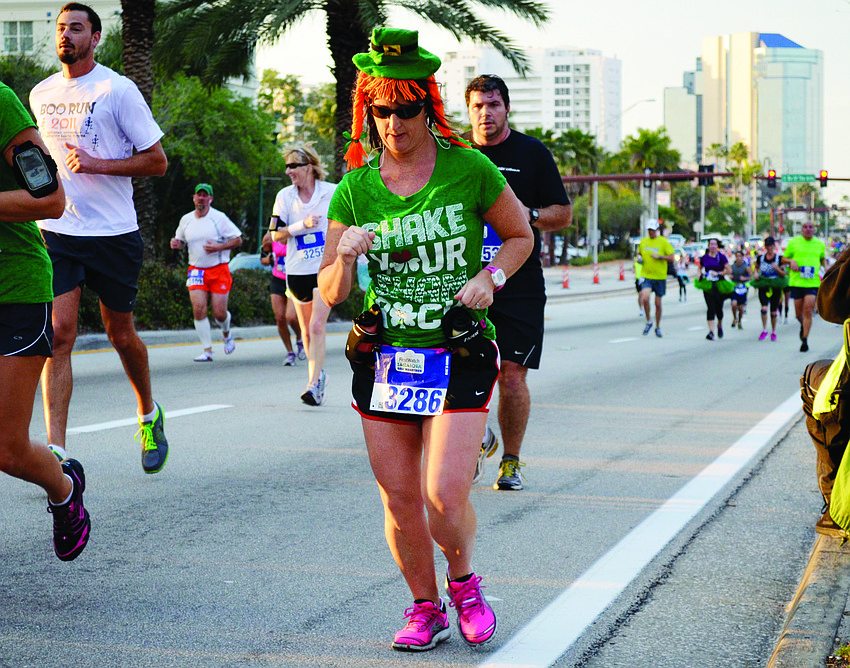 Maria Casserly runs in the First Watch Sarasota Half Marathon March 17. Runners competed in the 13.1-mile race dressed in St. Patrick's Day attire.