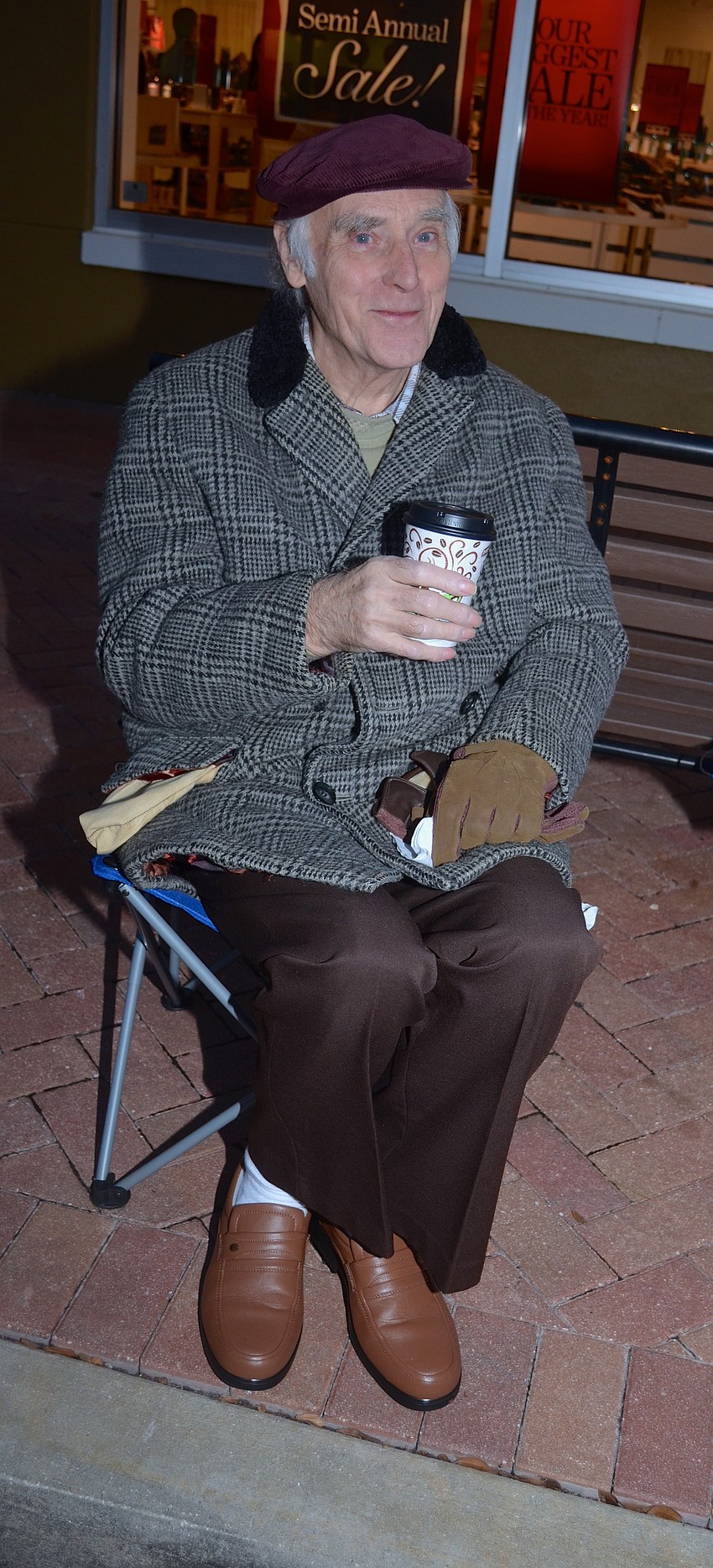 John Harbert sips on a hot beverage to warm up.