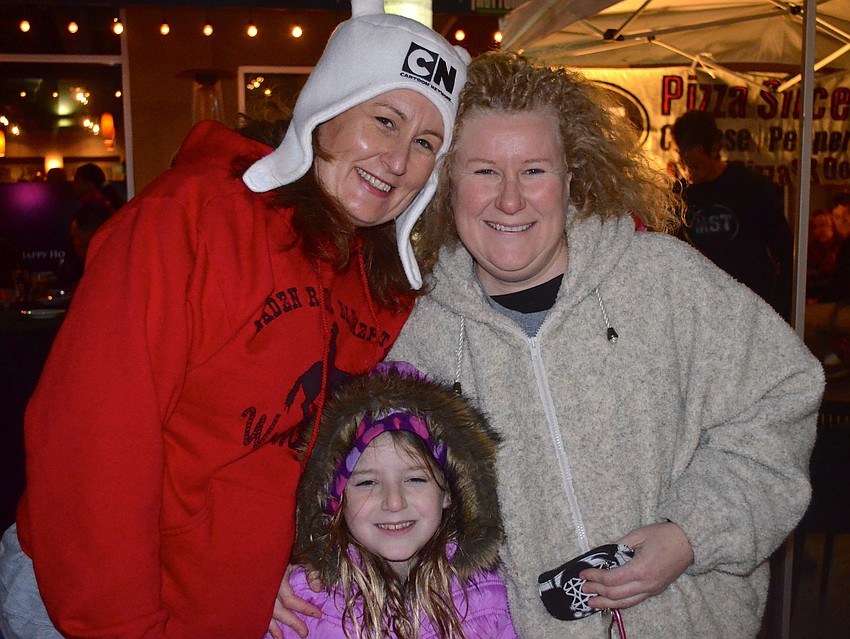 Nancy Kolde, Emily Ellis, 8, and Carrie Ellis.
