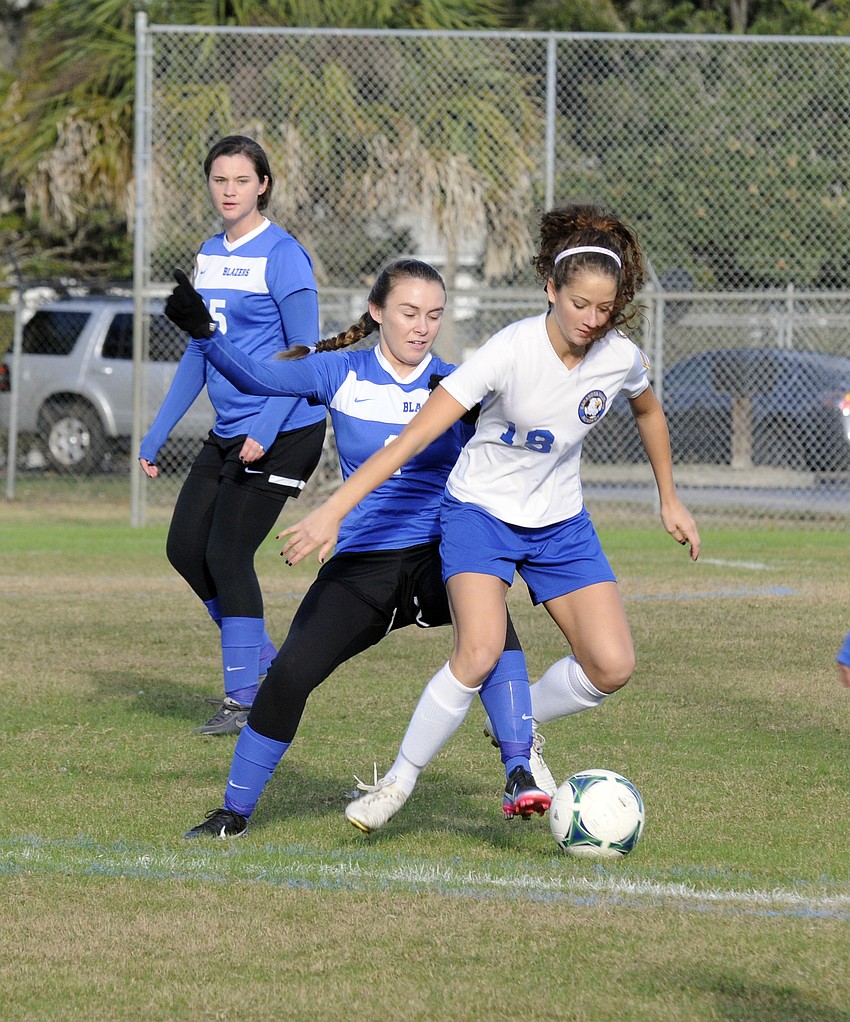 Sarasota Christianâ€™s Cecelia Genson attempts to steal the ball away from Sarasota Military Academyâ€™s Alyson Gable.
