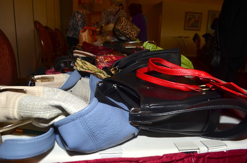 Palm-Aire Women's Club members brought in their gently-used purses that other members bid on later in the afternoon.