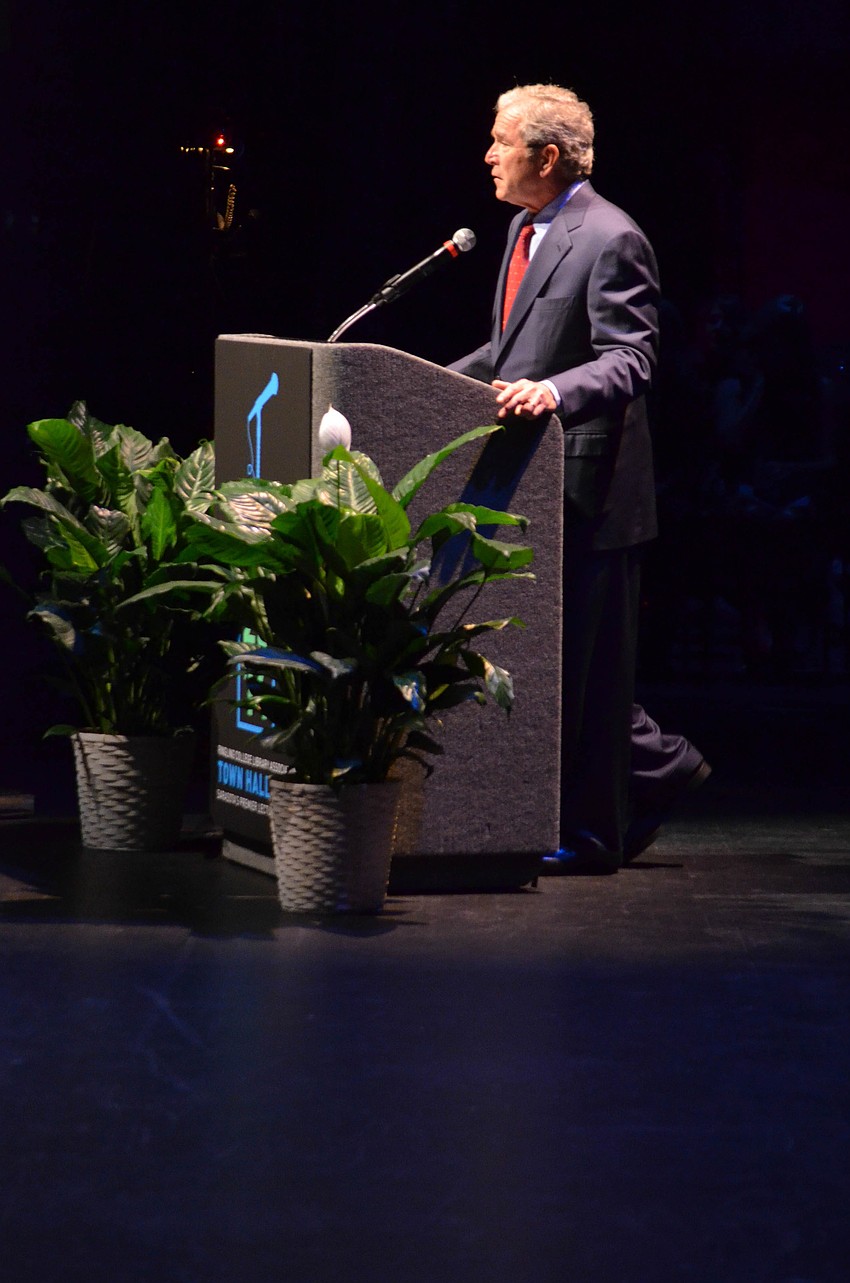 Within the first three minutes of speaking, Bush addresses his painting hobby.