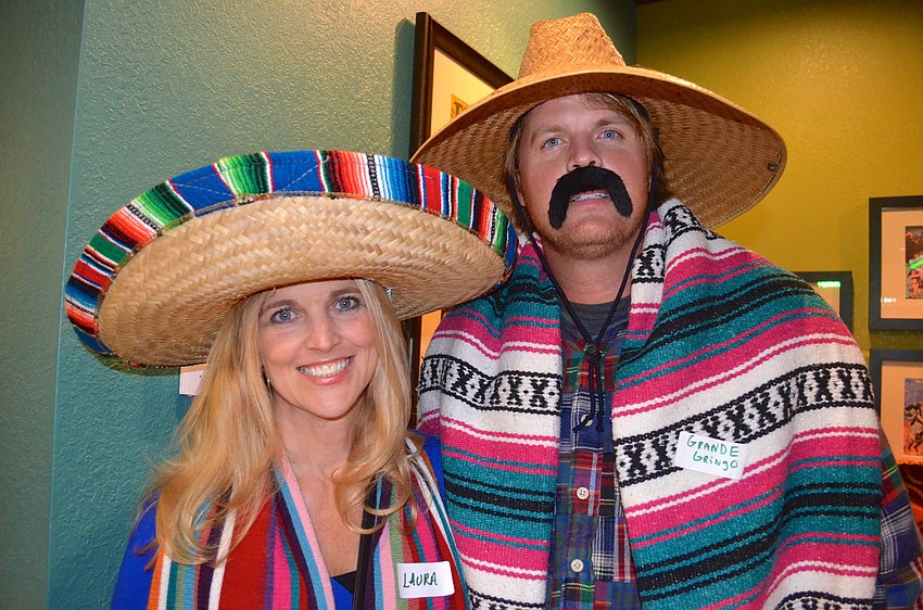 Laura Walters and Eric Perry play dress up for the night.