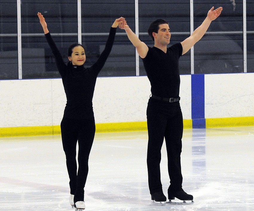 U.S. figure skaters Felicia Zhang and Nathan Bartholomay receive a round of applause from fans during an open training session Jan. 22, at the Ellenton Ice and Sports Complex.