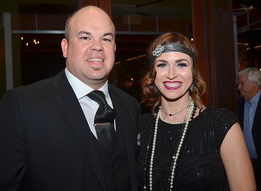 Couple Curt and Kati Ramage cozy up during the chilly evening.