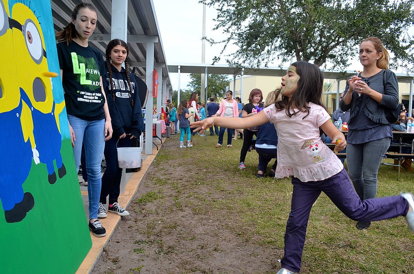 Six-year-old Camilla Ruiz plays games for prizes.