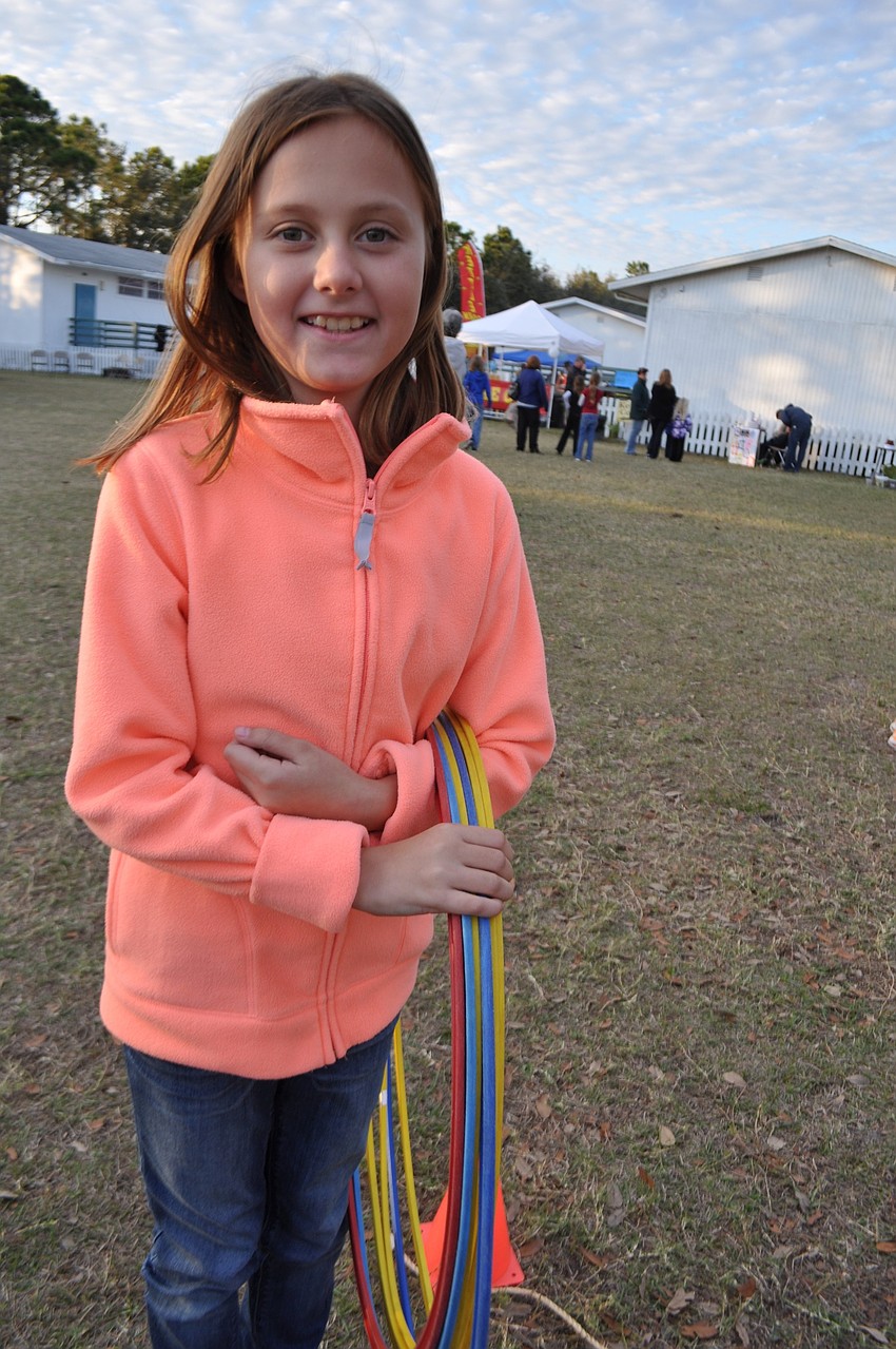 Nicolette Woodruff, 11, mans the 