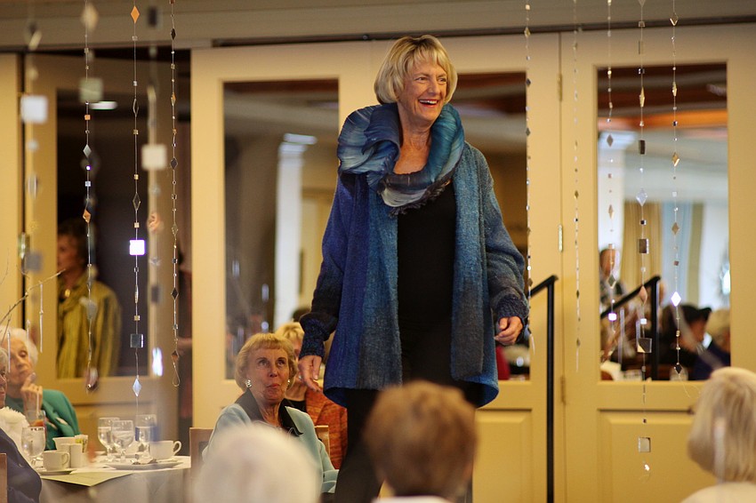 Susie Klingeman models a silk jacket and scarf.