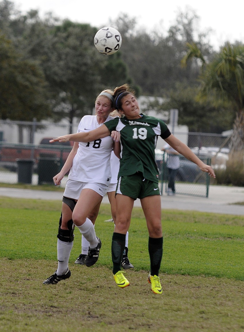 Lakewood Ranch senior Bri Reda and a Seminole defender go up for the ball during the first half.