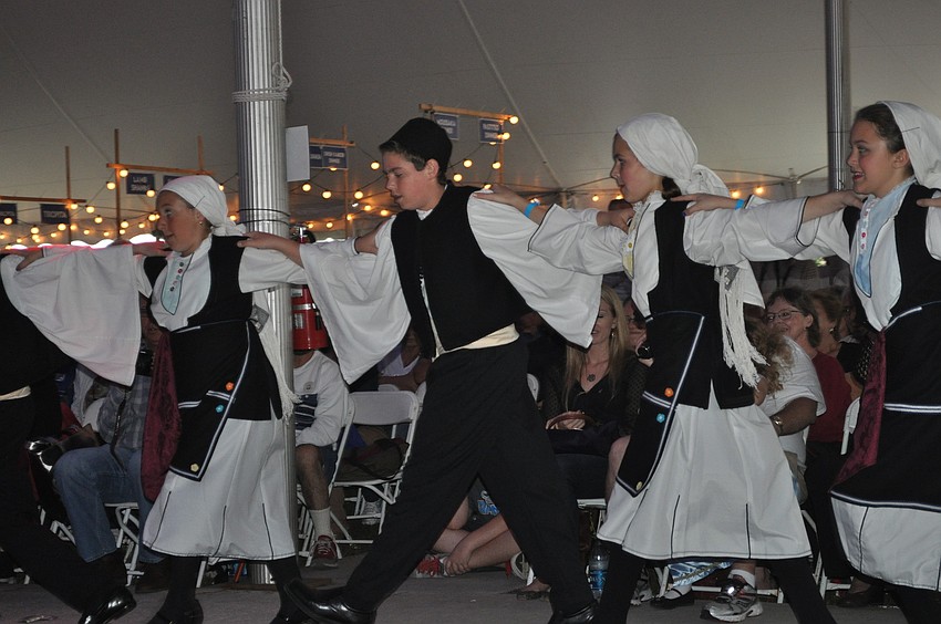 Hellenic folk dancers circled the crowd.