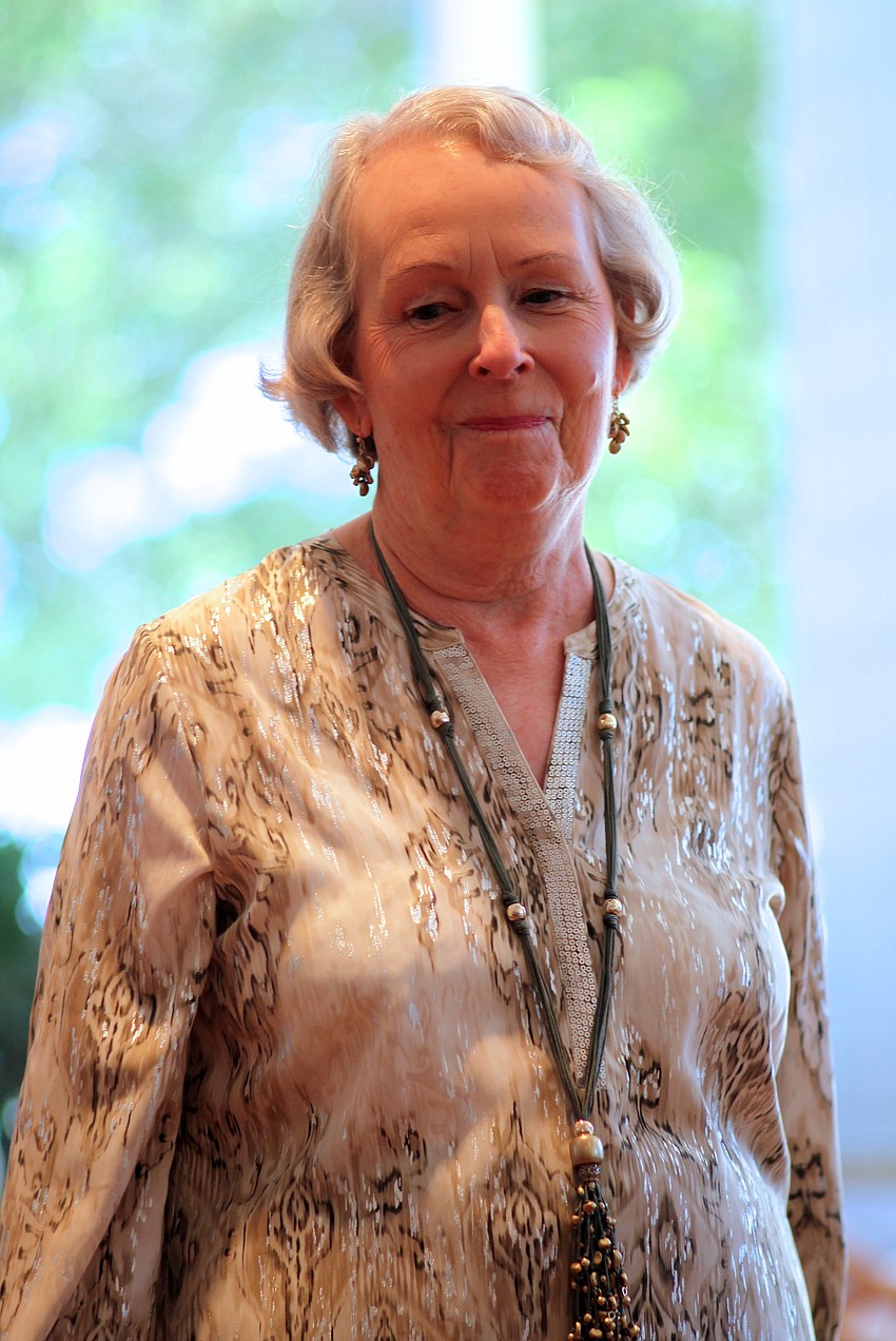 Diane Vanderpoel models a neutral tunic with a longer necklace.