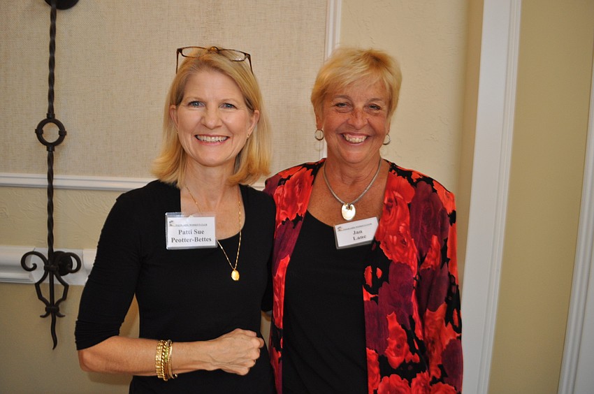 Patti Sue Bettes with Jan Lane register guests.