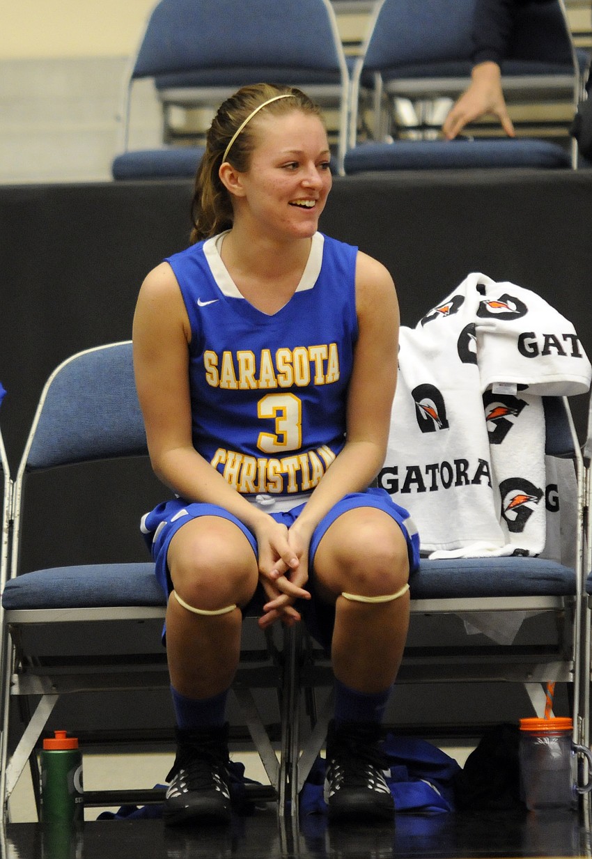 Sarasota Christianâ€™s Nicole Miller cheers on her teammates from the bench.