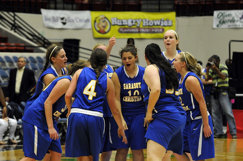 The Sarasota Christian girls basketball team celebrates following its 68-59 victory over Academy at the Lakes in the FHSAA Class 2A state semifinals Feb. 18.