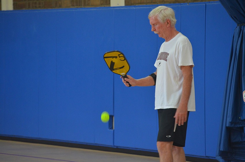 Dennis Sweeney prepares to serve.