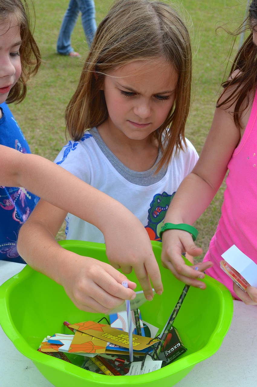 Six-year-old Brooke Sekula picks out her favorite pencil of the bunch.